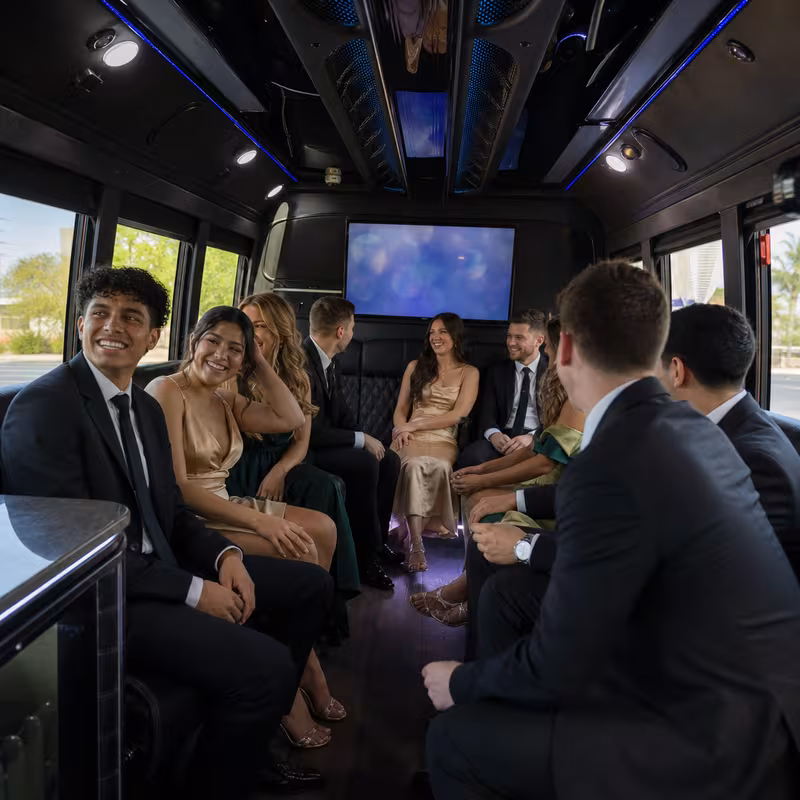 Wedding guests seated inside a Scottsdale party bus