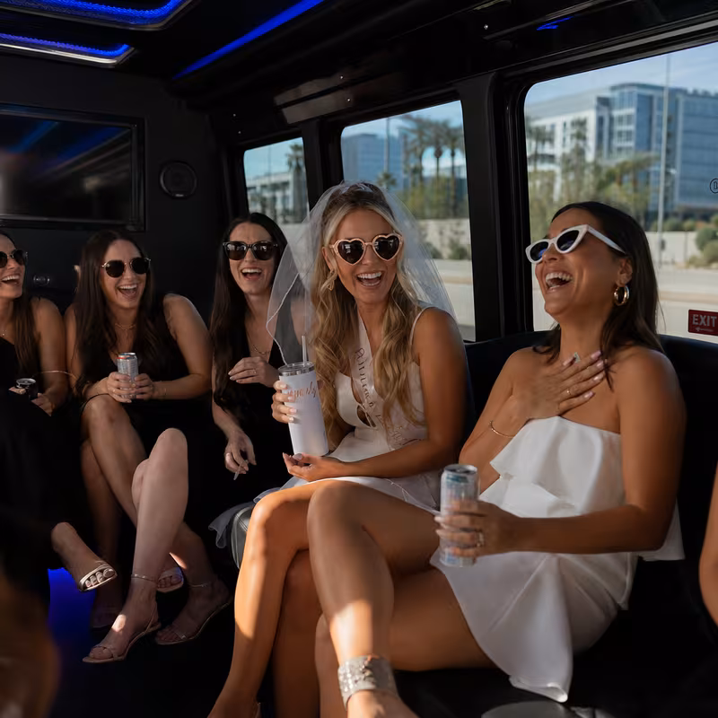 Party bus interior with wraparound leather seating and LED lighting in Scottsdale