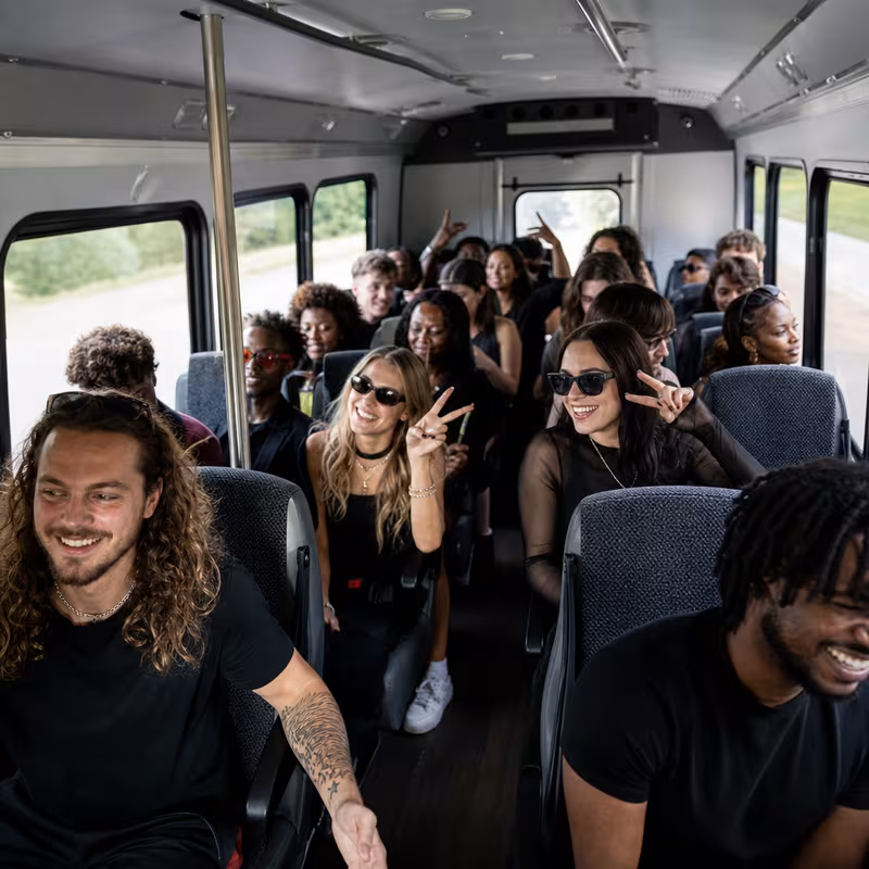 Party bus interior with wraparound leather seating and LED lighting in Scottsdale
