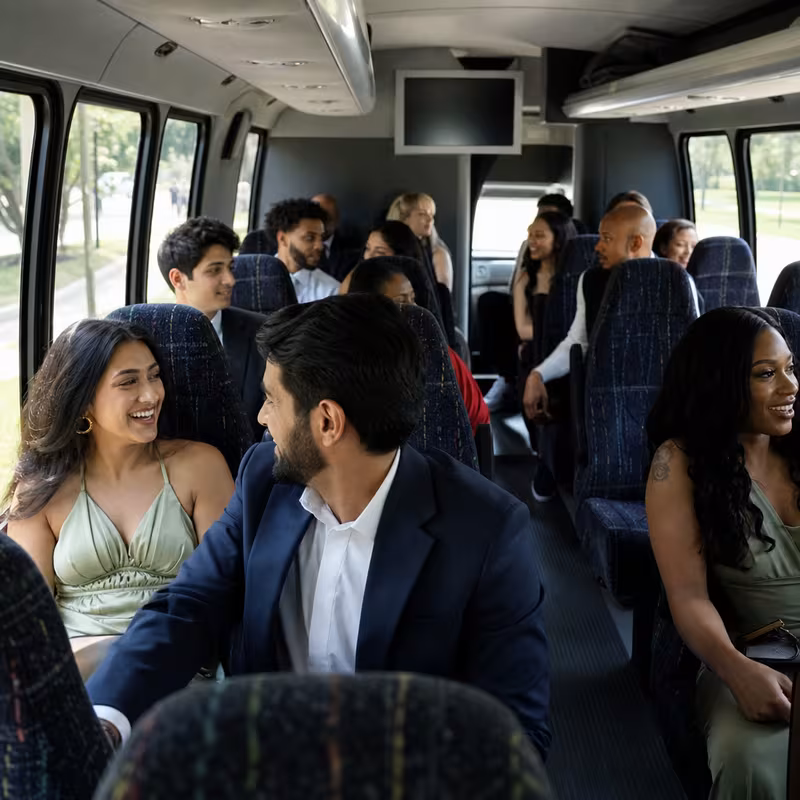 Group boarding a white charter bus for Private Event Transportation transportation in Scottsdale