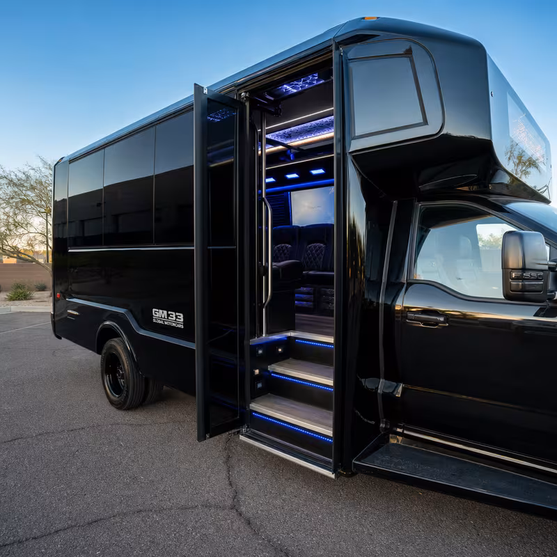 Party bus interior with wraparound leather seating and LED lighting in Scottsdale