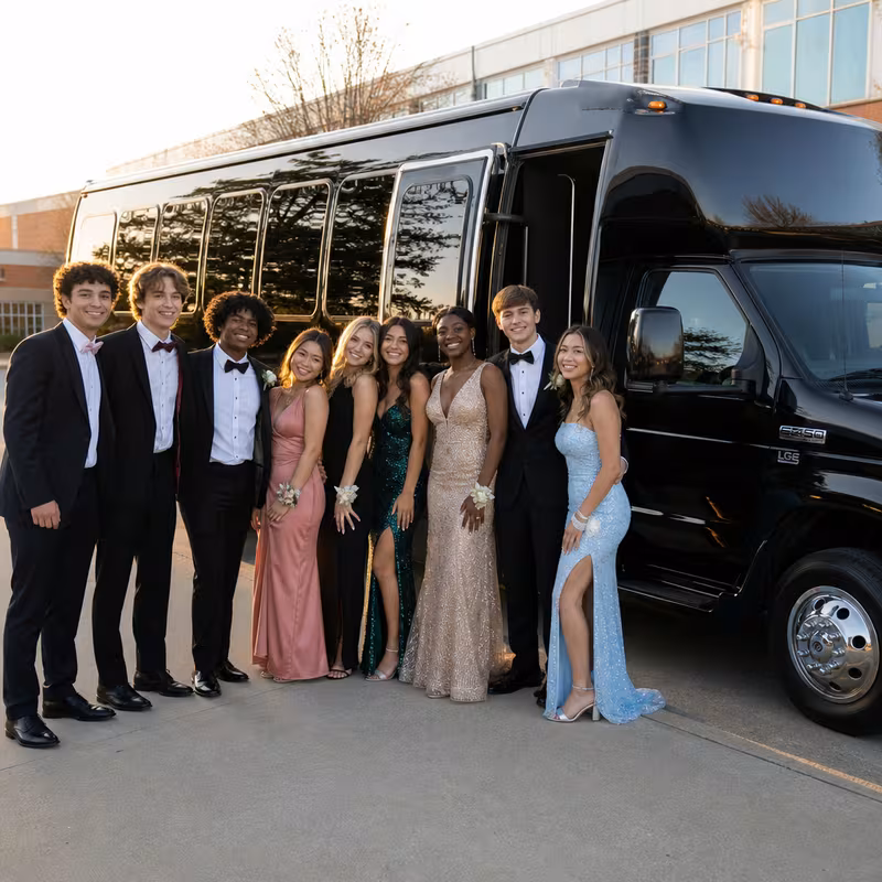 Group boarding a white charter bus for Prom & Homecoming Transportation transportation in Scottsdale
