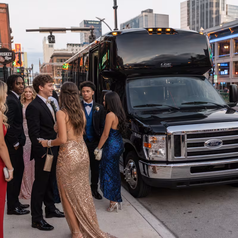Passengers loading luggage while boarding an Scottsdale group shuttle