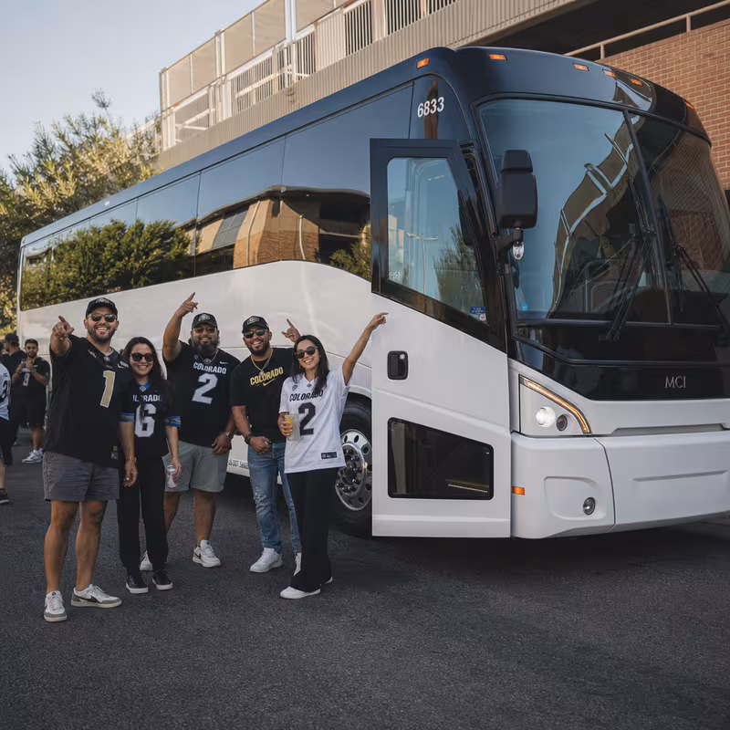 Passengers loading luggage while boarding an Scottsdale group shuttle