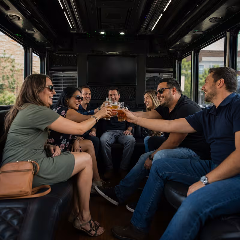 Group boarding a white charter bus for Winery & Brewery Tour Transportation transportation in Scottsdale
